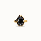 Ring with oval faceted black crystal